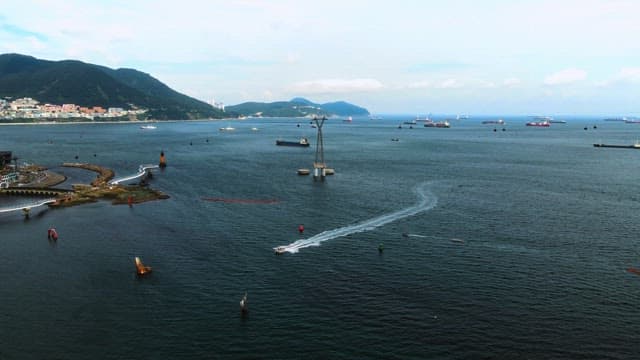 Boats Sailing in a Busy Harbor