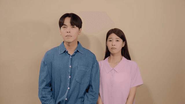 Man and a woman looking straight ahead with tears in their eyes