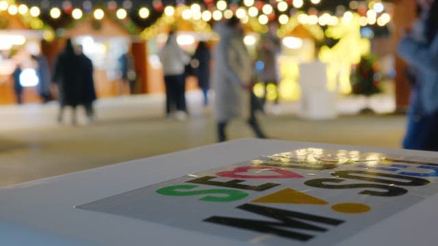 Festive lights and people at a christmas market