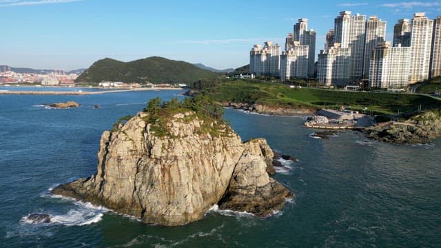 Beautiful rocky island with tall buildings