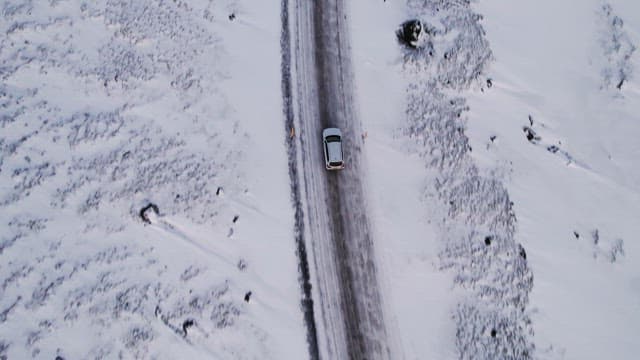 Car driving on a snowy road