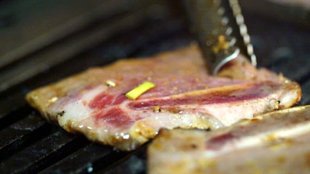 Sizzling Meat on a Hot Grill