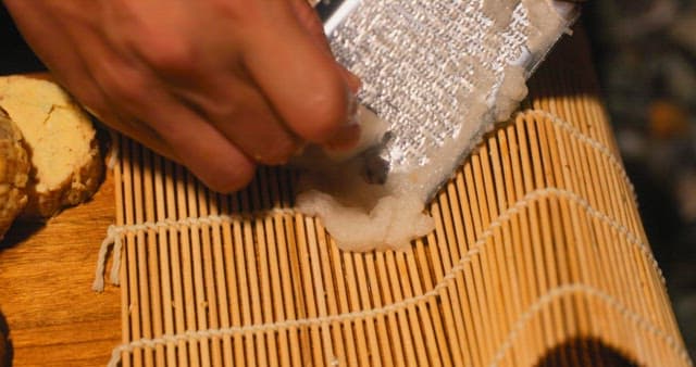 Preparing Grated Dish on Bamboo Mat
