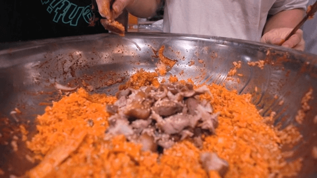 Mixing pig trotters and julienne Korean radish salad bibimbap