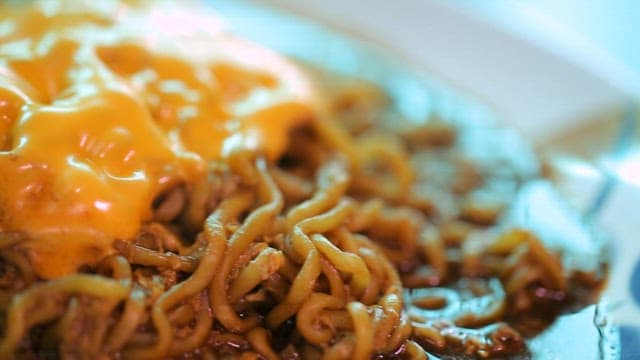 Cheese blackbean ramyeon on a plate