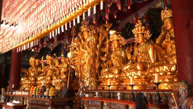 Golden Buddhist statues in a temple