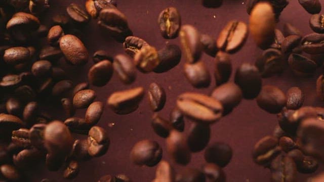 Slow-motion coffee beans falling