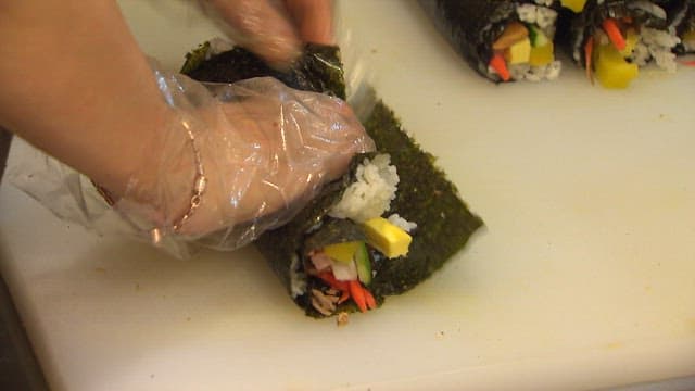 person who rolls gimbap
