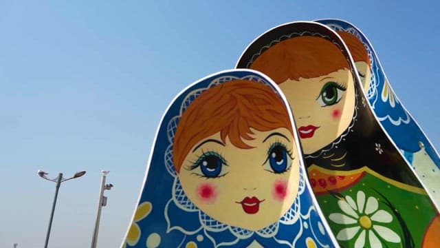Colorful Matryoshka Dolls Under Blue Sky