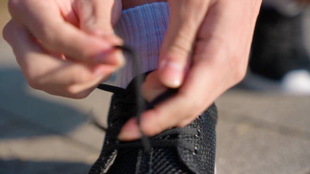 Tying shoelaces on a sunny day