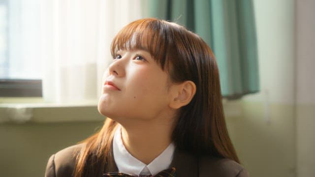 Student in a classroom with sunlight