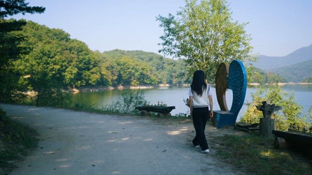 A Serene Lake Walk on a Sunny Day