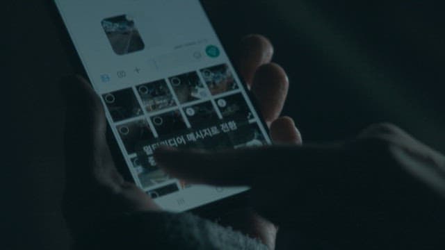 Person Sending a Photo Via Text Message Using Smartphone