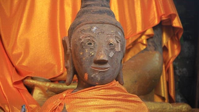 Buddha statue with orange robe