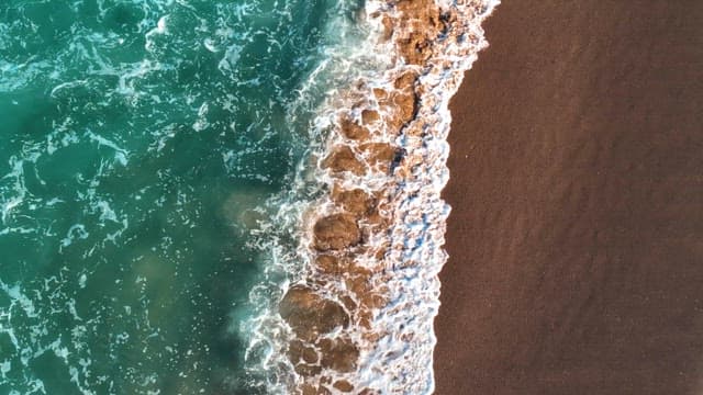 Waves crashing on a sandy beach