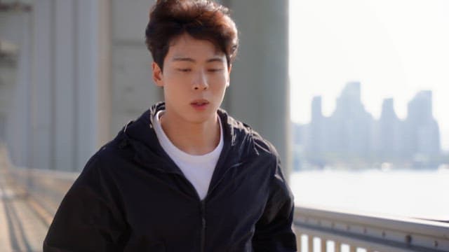 Man jogging on a jamsu bridge