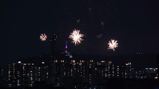Fireworks illuminating the city skyline