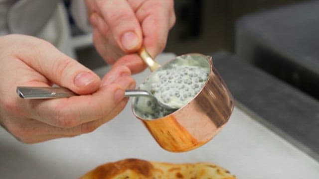Preparing a Bread with Luxury Caviar as Topping