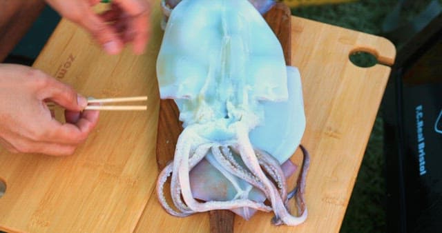 Preparing Fresh Squid on a Cutting Board