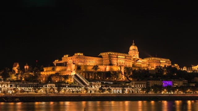 View of the historic Buda Castle from night to morning