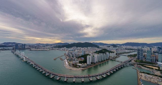 Busan's buildings and Gwangan Bridge from dawn to night