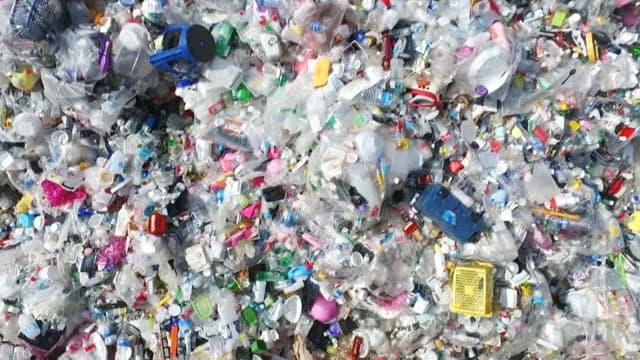 Massive landfill filled with various types of plastic waste