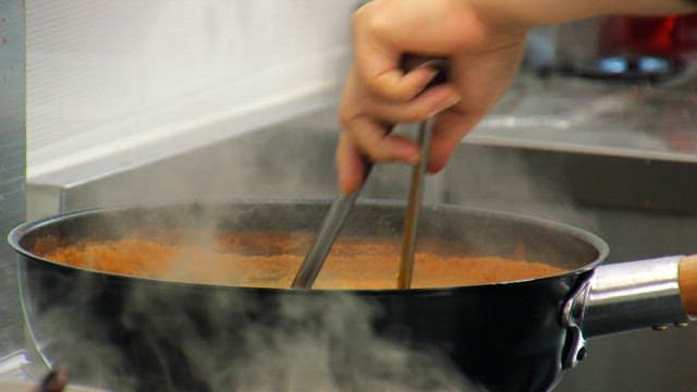 Cooking noodles in a steaming pot