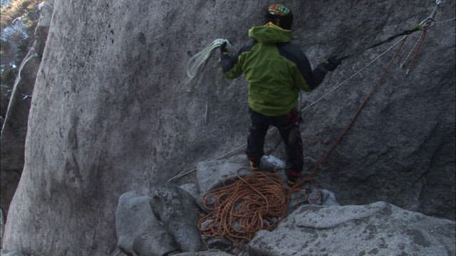 Climber Preparing for an Ascent Outdoors