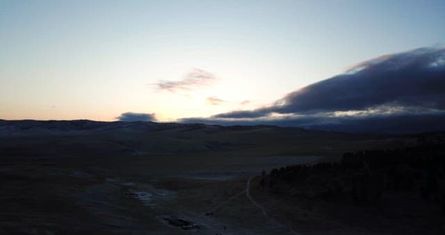 Sunrise over a vast mountain landscape