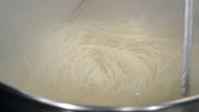 Noodles boiling in a pot