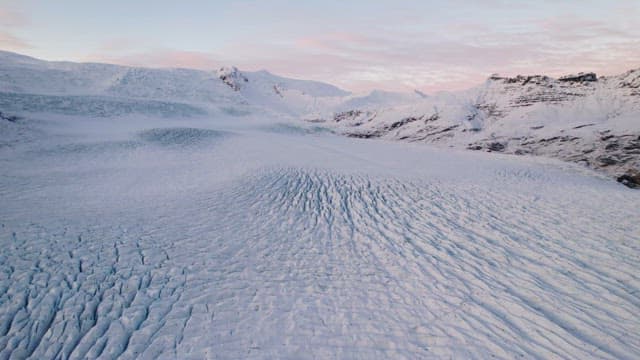 Vast glacier with snowy mountains