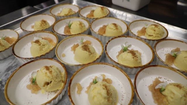 Gourmet Dessert Being Served from a Kitchen