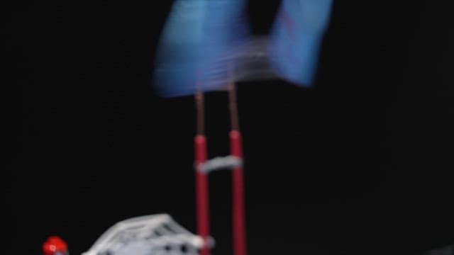 Scientist applying glue to an electrode wire while wearing gloves