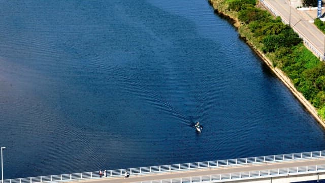 Kayaker paddling on a calm river
