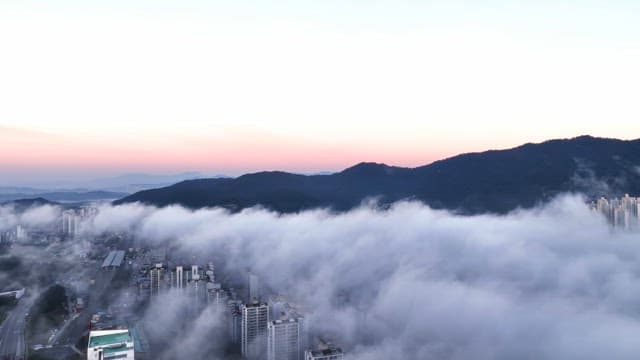 Sunrise over cloudy city