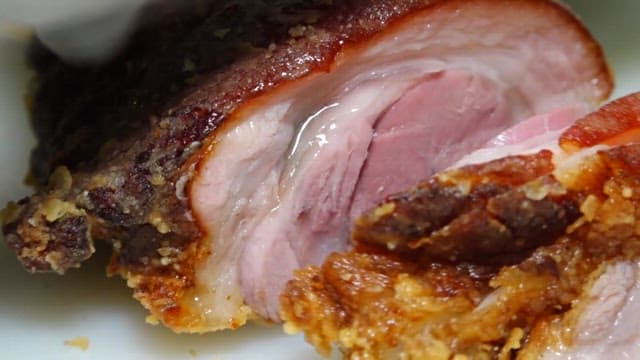 Fried pig's feet on top of fries