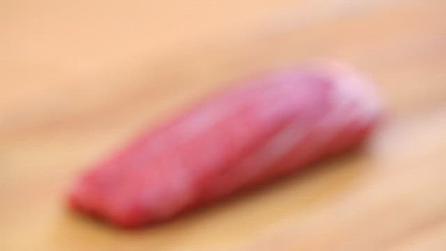 Fresh Raw Meat on Wooden Cutting Board