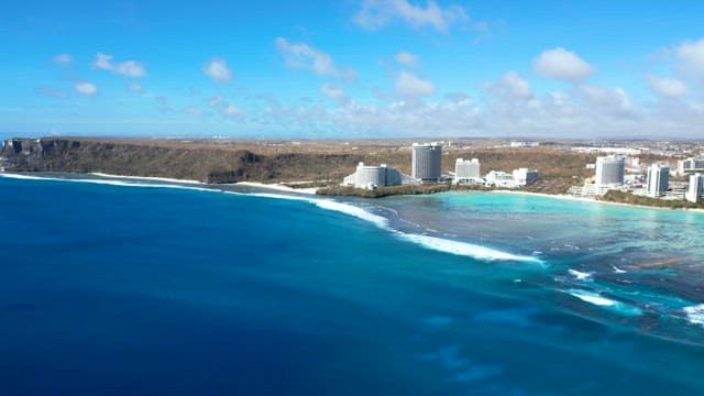Coastal City with Clear Emerald Colored Sea