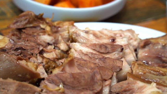 Plate of deliciously cooked sliced boiled meat