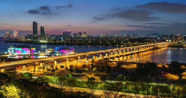 Seoul cityscape at night with Han River bridge
