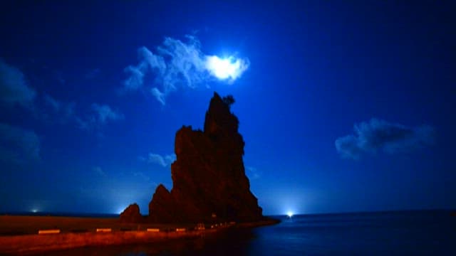 Night seascape with the silhouette of Ulleungdo Candlestick Rock
