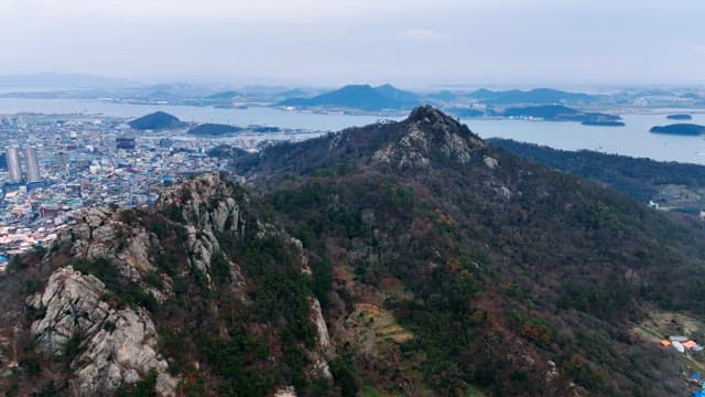 Mountain view with city and sea in the distance