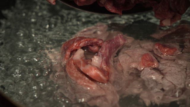 Cooking up a nutritious beef and radish soup in a large pot in the kitchen
