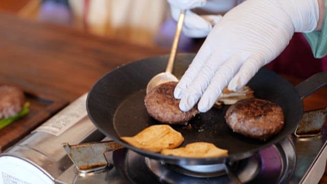 Cooking Tteokgalbi Patties Using a Spoon on a Frying Pan