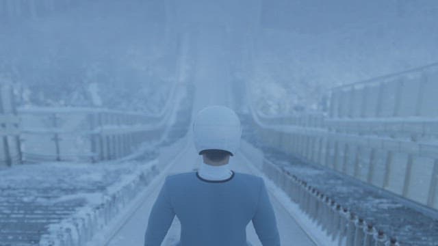 Ski Jumper Descending a Slope in Snow