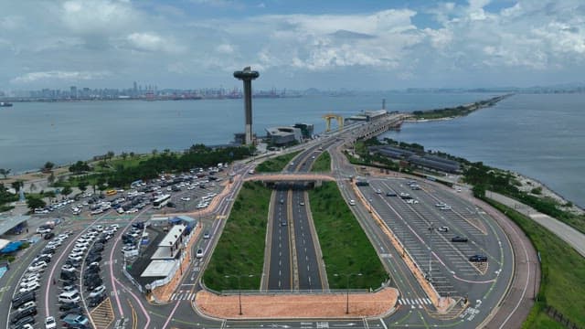 Coastal Highway and High-rise Observation Tower on a Cloudy Day