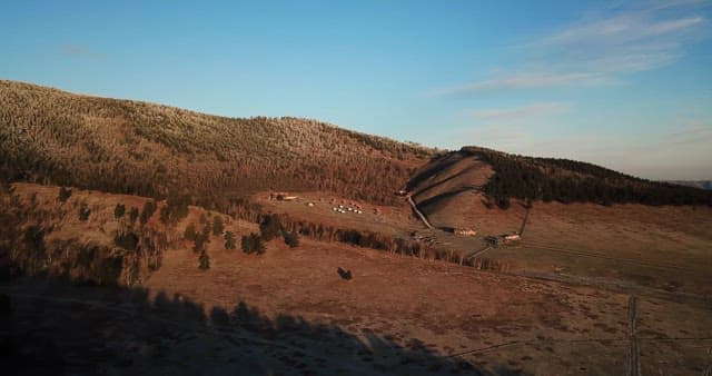 Vast landscape with mountains and fields