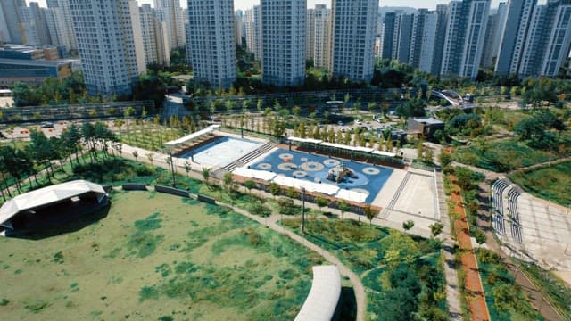 City park with playground and skyscrapers