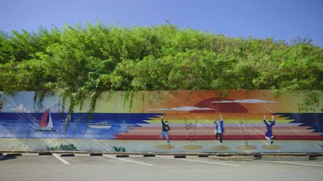 Colorful street mural under a clear sky