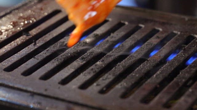 Sizzling Meat on a Hot Grill